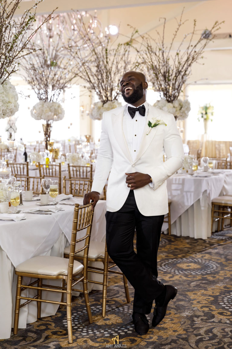 groom in white blazer statuesque events